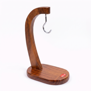 Handcrafted Sheesham wood banana stand with metal hook isolated on white background.